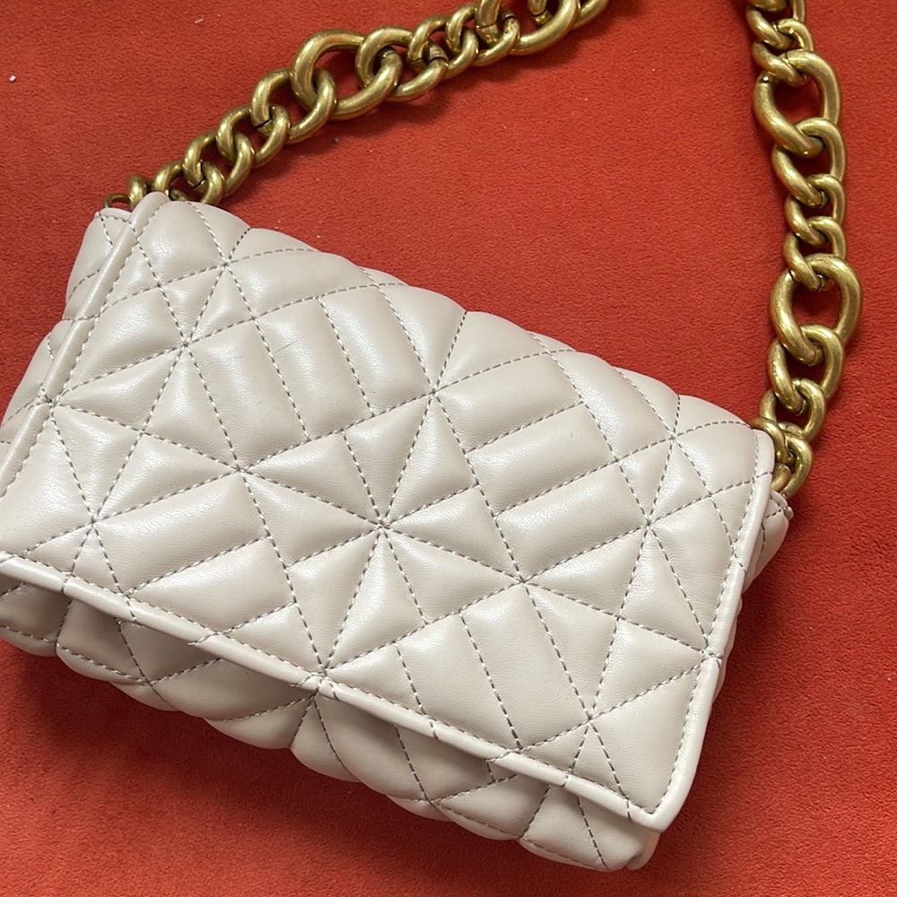 Zara beige bag with chain strap.